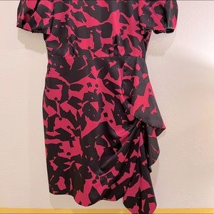 Beautiful satin Milly dress, with flowing ribbon on one side